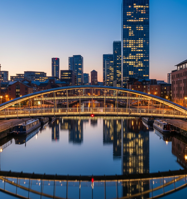 A footbridge over the canal basin in central Manchester at dusk